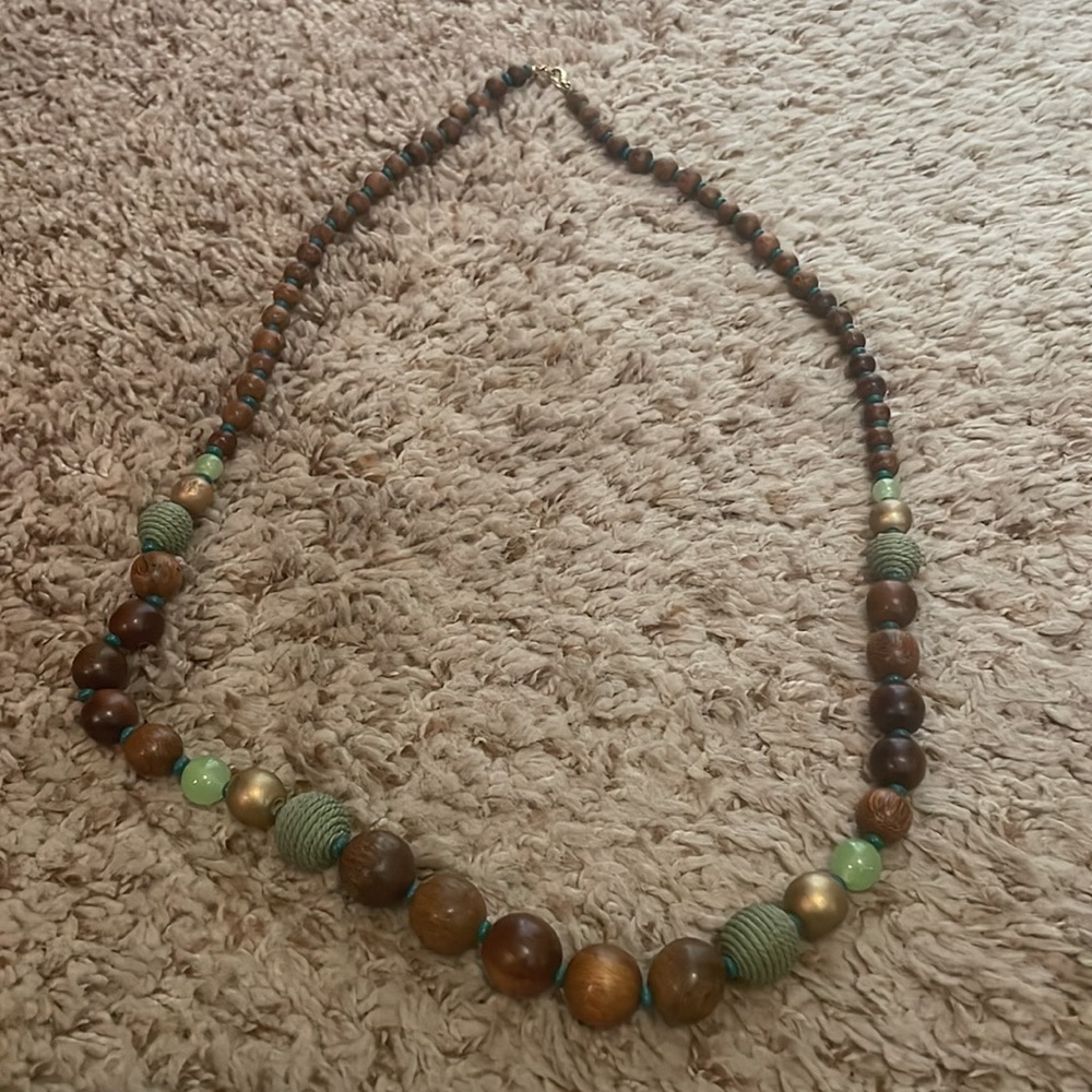 Wooden beaded bracelet with green accent